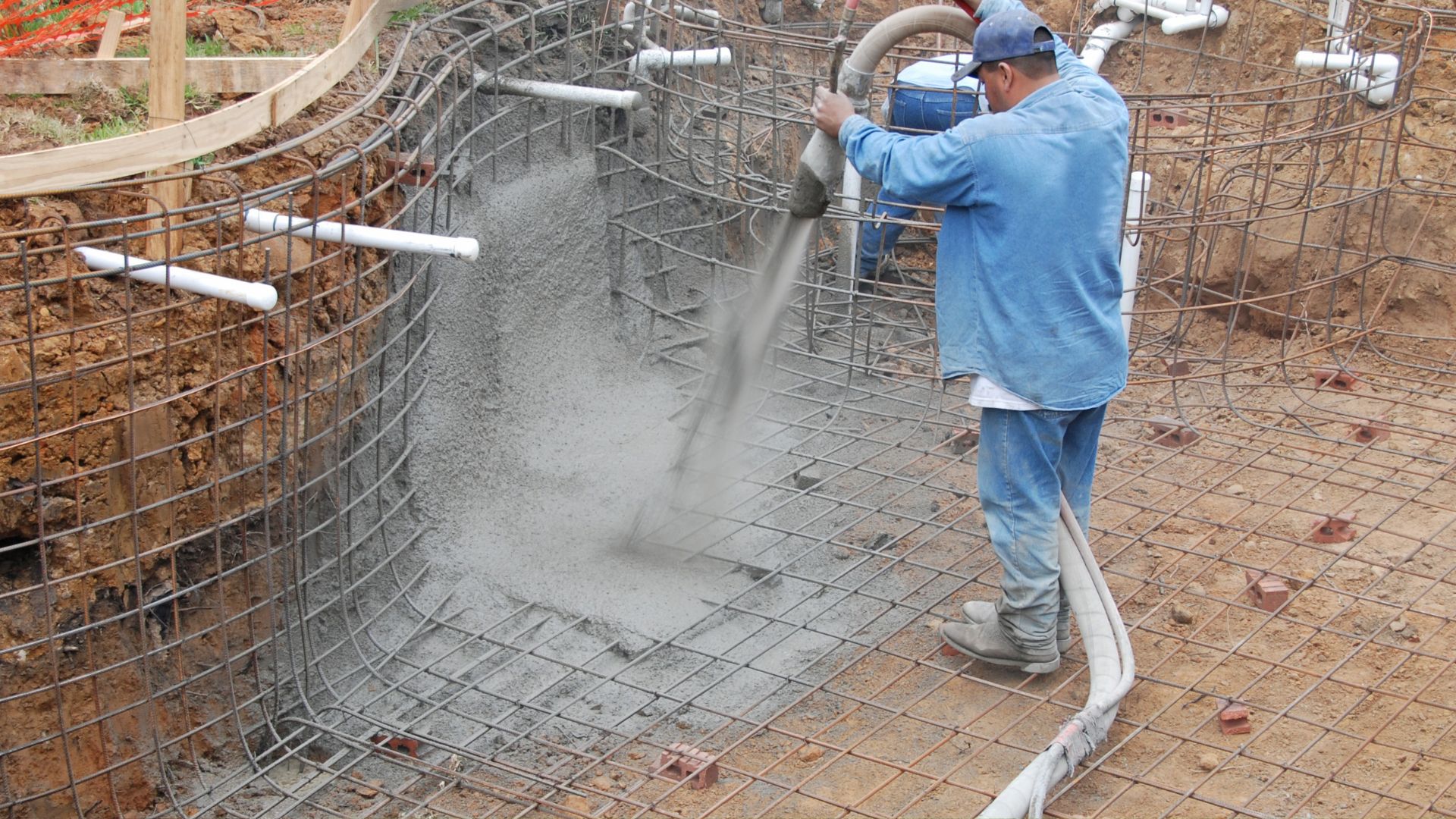 Shotcrete application during new pool installation by From The Ground Up Pools in Clearwater