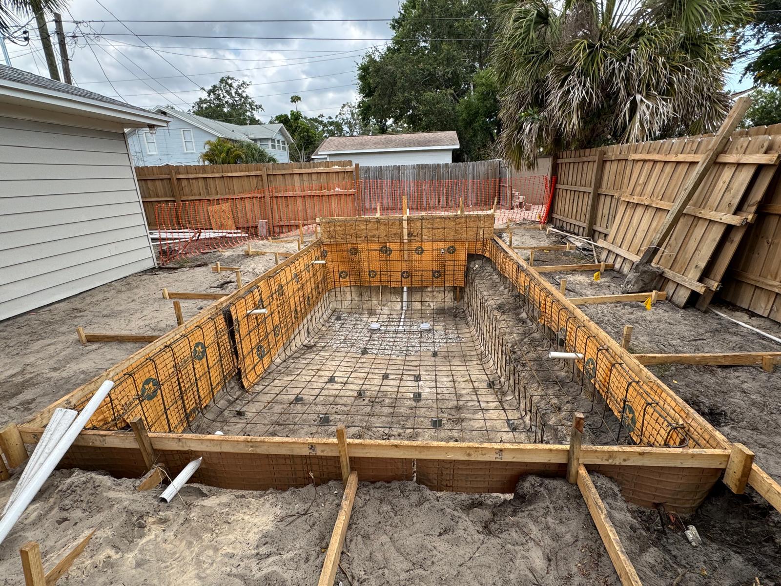 Excavation site prepared for pool installation by From The Ground Up Pools